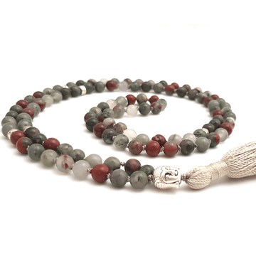 Handmade Empowering Mala Necklace – Bloodstone for Strength & Protection with Buddha head guru bead curled on table